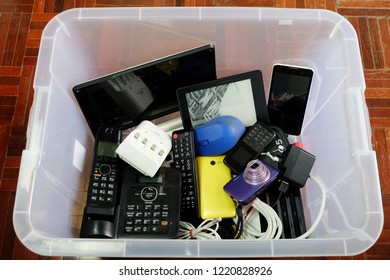 Used Modern Electronic Waste Or Gadgets For Daily Use In Clear Plastic Box