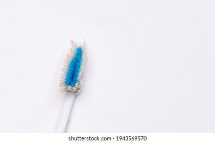 Used Old Toothbrush Isolated On A White Background.