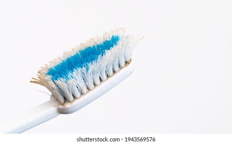 Used Old Toothbrush Isolated On A White Background.