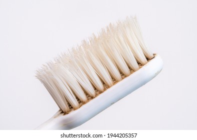 Used Old Toothbrush Isolated On A White Background.