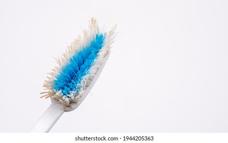 Used Old Toothbrush Isolated On A White Background.