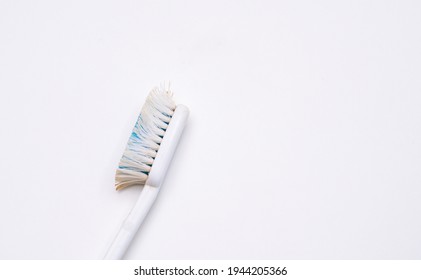 Used Old Toothbrush Isolated On A White Background.