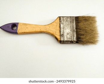 Used paint brush with wooden handle isolated on white background - Powered by Shutterstock