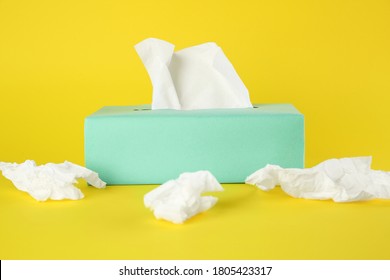 Used Paper Tissues And Box On Yellow Background