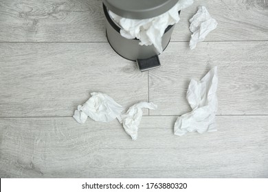 Used paper tissues and trash can on wooden floor, above view - Shutterstock ID 1763880320