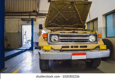 Used Pick Up Truck In A Mechanic Shop With Hood Open