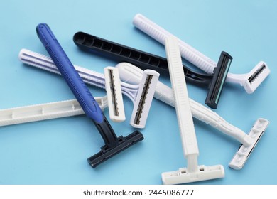 Used razor waste on blue background.