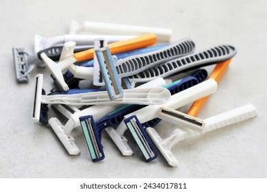 Used razor waste on grey background.