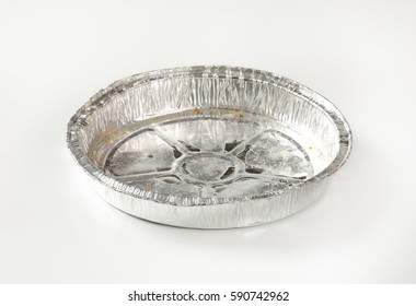 Used Round Tin Foil Cake Pan On White Background