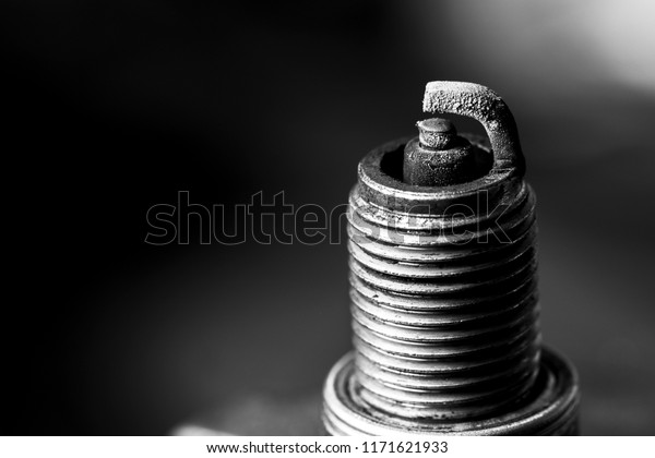 Used spark plug car , selected focus, auto service,\
black and white image