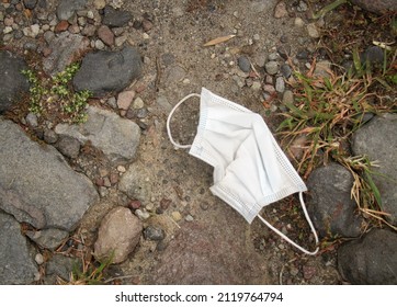 Used Surgical Mask, On The Ground, Covid Pandemic Times                              