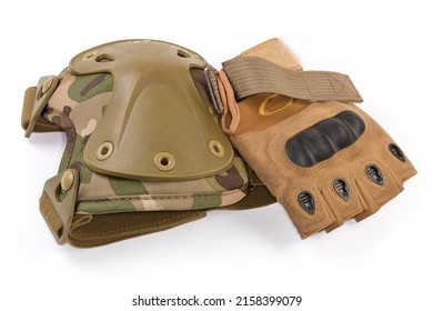 Used tactical military knee pad and combat leathern fingerless glove on a white background