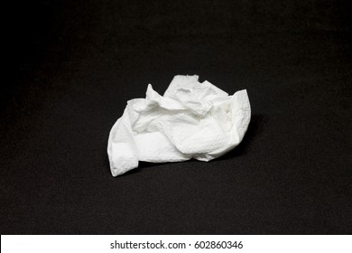 Used Tissue On Black Background.