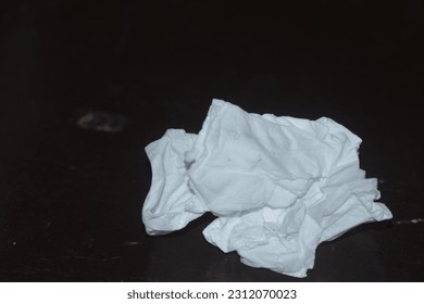 used tissue on the table - Shutterstock ID 2312070023