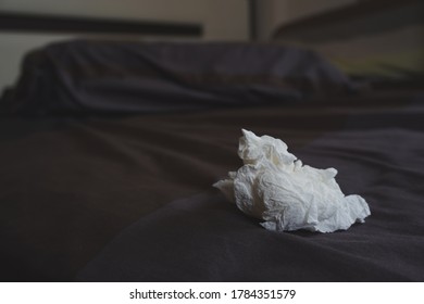 Used Tissues On Unmade Bed.