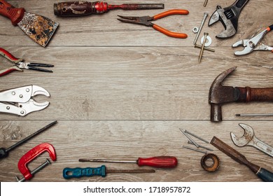 Used tools on wooden workbench