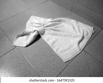 used towel lying on floor