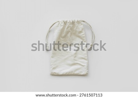 Used Wrinkled Empty Fabric Drawstring Pouch Top View On White Background