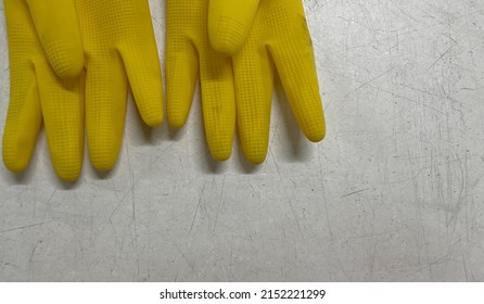 Used Yellow Rubber Gloves From A Chemical Factory