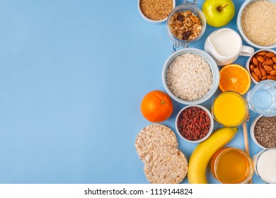 Useful breakfast on a blue pastel background, top view.