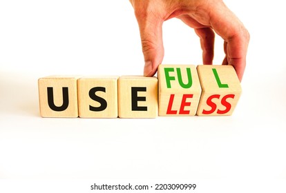 Useful or useless symbol. Concept words Useful or Useless on wooden cubes. Businessman hand. Beautiful white table white background. Business useful or useless concept. Copy space. - Shutterstock ID 2203090999