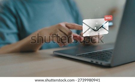 User checking email notification on laptop with message and more 999 unread alert, digital communication, inbox management, online marketing and business correspondence.