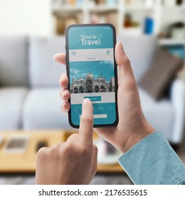 User Connecting With Her Smartphone At Home And Online Travel Booking App On The Phone Display, POV Shot