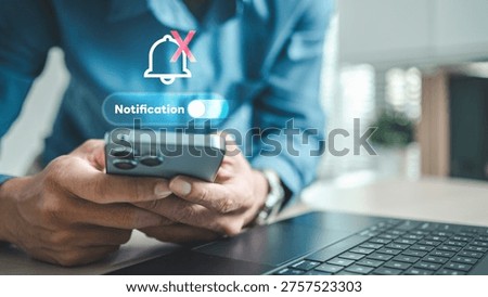 User disabling mobile notifications using do not disturb settings on smartphone. Concept of digital focus mode, notification control, quiet productivity, and managing alerts.
