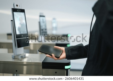 User Engaging with High-Tech Access Control System at Security Checkpoint  