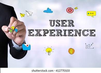 USER EXPERIENCE and Businessman drawing Landing Page on blackboard - Powered by Shutterstock