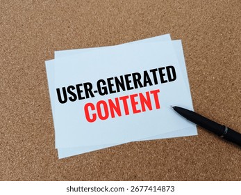 User Generated Content Concept on Paper Representing Social Media Engagement, Audience Participation, Online Community and Digital Marketing Strategy. 