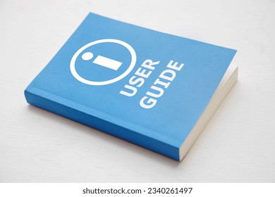 User guide book, Blue cover book on white background, instruction manual for user training 