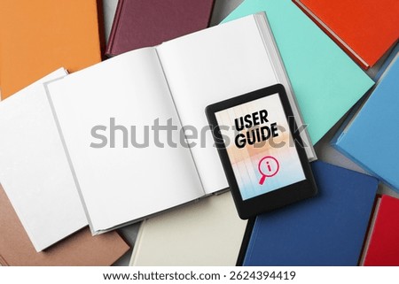 User Guide document open in e-book device and many different books, to view