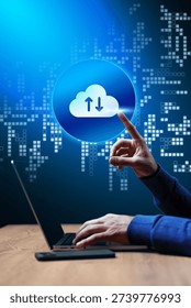 User interacts with cloud technology on laptop for data transfer during early evening hours