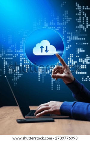 User interacts with cloud technology on laptop for data transfer during early evening hours