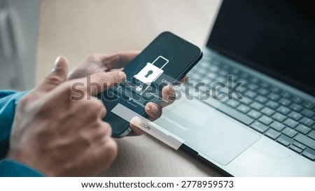 User logging into secure mobile account with password screen beside laptop, representing MFA, two factor authentication, identity verification and cybersecurity protection for digital access.