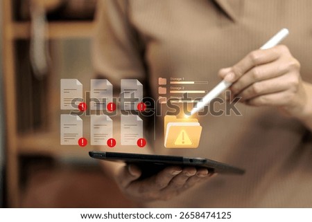 User managing tablet with digital warning signs, alert documents, and low storage notification. Data error concept.
