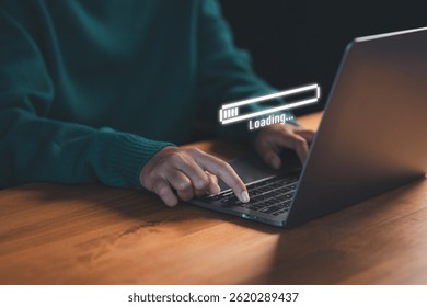 User types on a laptop with a floating "Loading..." progress bar, representing data processing or digital wait time in a modern tech environment, anticipation of technology responding.