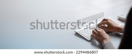 The user is typing a keyboard with a hologram search box. Searching information on the Internet, cloud information online can search information from all over the world. Search engine.