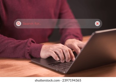 User using a laptop computer clicking internet search bar. SEO technology networking engine optimization internet with search bar. Searching browsing internet data information concept.