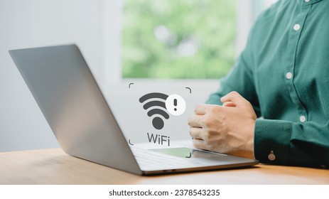 User using a laptop computer to connect to wifi but wifi not working or password is incorrect and waiting to loading digital data form website.Technology concept of wifi connected but no internet.