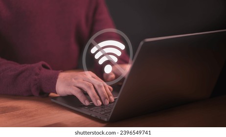 User using a laptop computer to connect to wifi but wifi not connected or password is incorrect and waiting to loading digital data form website. Technology concept of wifi connected but no internet.