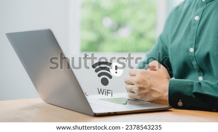 User using a laptop computer to connect to wifi but wifi not working or password is incorrect and waiting to loading digital data form website.Technology concept of wifi connected but no internet.