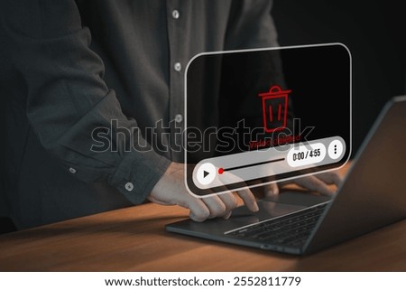 User using a laptop computer with a "Video deleted" message and a play icon overlay, representing content removal, digital media loss, or video restrictions on a digital platform.
