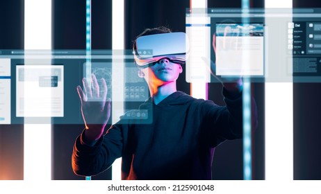 User wearing a VR headset, he is interacting with virtual screens and user interfaces, virtual desktop concept