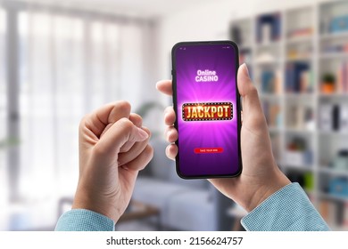 User winning jackpot on online casino app, online games and gambling concept, POV shot - Shutterstock ID 2156624757