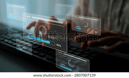 User Working on Keyboard with Loading Screens and Progress Bars in a Modern Digital Environment Representing Technology and Data Processing Activities Gluon.