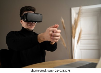 Uses virtual glasses Programmer break man in stylish clothes working in a coworking space
