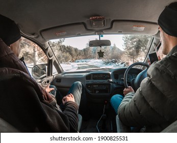 Ushguli, Georgia - 12.15.2018 Two Guys Driving Car To Ushguli Village In Georgia. Tourists In Winter At Georgia