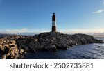 Ushuaia Lighthouse At Ushuaia In Tierra Del Fuego Argentina. Amazing Bay Water. Maritime Excursion. Boat Sailing Scene. Ushuaia Lighthouse At Ushuaia In Tierra Del Fuego Argentina.